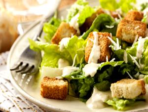 1 1/2 cups with dresssing (142 g) A Complete Salad Caesar Style