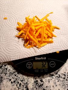 1/4 cup (32 g) Shredded Cheddar