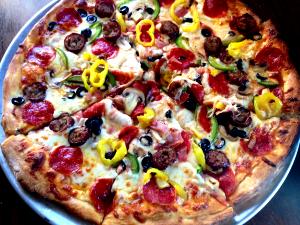 1/8 Pizza Medium Extravaganzza: Pepperoni, Ham, Green Pepper, Onion, Black Olive, Mushroom, Sausage, Beef, Extra Cheese Feast Pizza