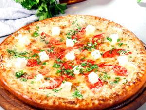 1/8 Pizza Medium Hand Tossed 4+ Toppings Pizza