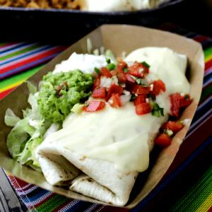 1 burrito (519 g) Double Smothered Chicken Burrito - Chili Queso