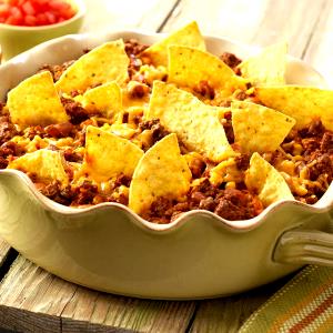 1 Cup Mexican Casserole made with Ground Beef, Beans, Tomato Sauce, Cheese, Taco Seasonings and Corn Chips