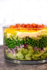 1 Cup Seven-Layer Salad (Lettuce Salad Made with A Combination Of Onion, Celery, Green Pepper, Peas, Mayonnaise, Cheese, Eggs and/or Bacon)
