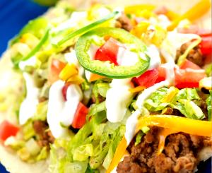 1 Cup Soft Taco with Beef, Cheese, Lettuce, Tomato and Sour Cream
