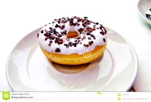 1 donut (94 g) White Cake Donut - Vanilla Iced with Chocolate Sprinkles