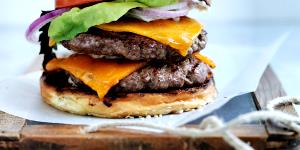 1 Double Cheeseburger Double Cheeseburger with Mayonnaise or Salad Dressing and Tomatoes on Bun