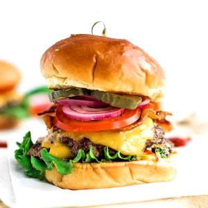 1 Double Hamburger Double Hamburger with Mayonnaise or Salad Dressing and Tomatoes on Bun
