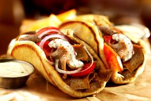 1 Gyro Gyro Sandwich (Pita Bread, Beef, Lamb, Onion, Condiments with Tomato and Spread)