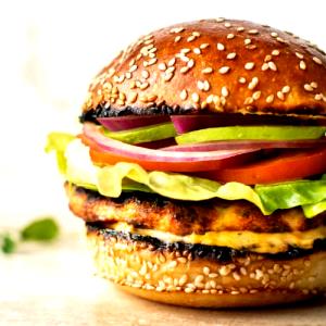 1 Hamburger Chicken Burger with Condiments and Vegetables on Bun