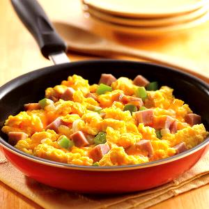 1 Medium Egg Omelet or Scrambled Egg with Cheese, Ham or Bacon and Tomatoes