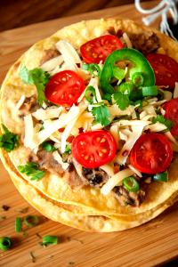 1 Mexican Pizza Taco or Tostada with Beans, Cheese, Meat, Lettuce, Tomato and Salsa