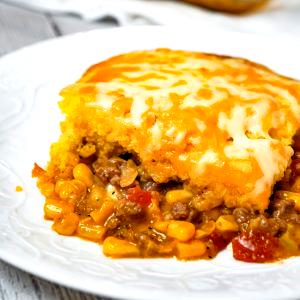 1 Oz Ground Beef with Tomato Sauce and Taco Seasonings On A Cornbread Crust