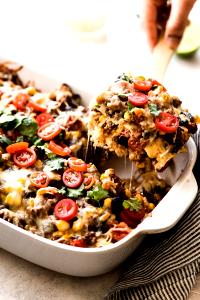 1 Oz Mexican Casserole made with Ground Beef, Beans, Tomato Sauce, Cheese, Taco Seasonings and Corn Chips