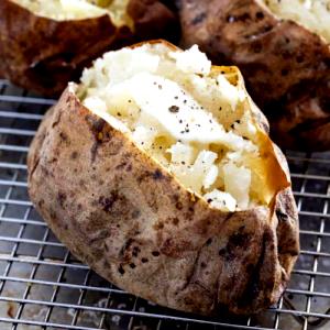 1 Oz, Raw, Yields Baked Potato (Peel Eaten, Fat Not Added in Cooking)
