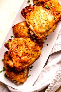1 Oz, With Bone (yield After Cooking, Bone Removed) Baked or Fried Coated Chicken Thigh with Skin