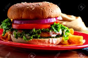 1 Sandwich Chicken Patty Sandwich with Cheese, Lettuce, Tomato and Spread on Wheat Bun