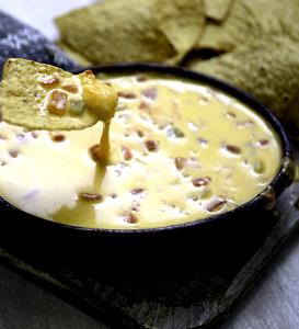 1 serving (2.25 oz) Chile Con Queso