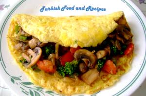 1 serving (383 g) Veggie Omelet with fresh Fruit Dish & dry Wheat Toast with Smucker