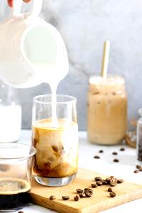 1 Serving Iced Latte, Medium - Skim Milk W/ Whip
