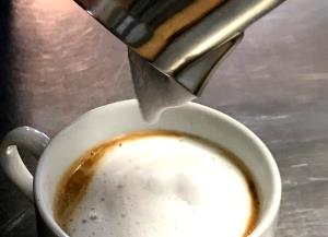 1 Serving Coffee With Steamed Milk, Small - Skim Milk W/ Whip