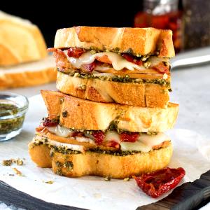 1 Serving Deli Turkey Pesto Club Sandwich