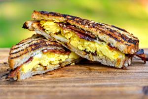 1 Serving Smoked Bacon & Cheddar Panini - Breakfast Potatoes Combo