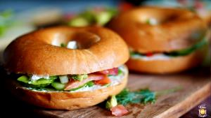 1 Serving Smoked Salmon And Wasabi On Onion Dill Bagel Sandwich