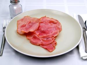 1 slice (100 g) 12" Hand Tossed Ham & Pineapple Pizza