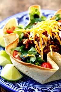 1 Taco Bell Taco Salad Taco or Tostada Salad with Beef, Beans and Cheese in Fried Flour Tortilla