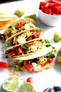 1 Taco Soft Taco with Beef, Cheese, Lettuce, Tomato and Sour Cream