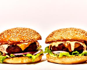 1 Triple Cheeseburger Triple Cheeseburger with Mayonnaise or Salad Dressing and Tomatoes on Bun