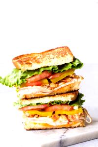 100 G Bacon, Chicken and Tomato Club Sandwich with Lettuce and Spread on Multigrain Roll