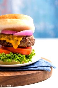 100 G Cheeseburger with 1/4 Lb Meat, Mayonnaise or Salad Dressing and Tomatoes on Bun