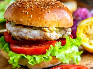 100 G Chicken Burger with Condiments and Vegetables on Bun