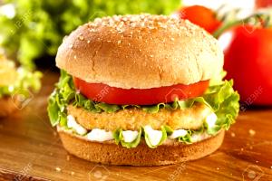 100 G Chicken Patty Sandwich with Cheese, Lettuce, Tomato and Spread on Wheat Bun