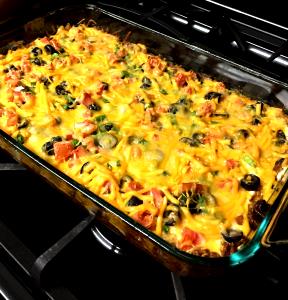 100 G Mexican Casserole made with Ground Beef, Tomato Sauce, Cheese, Taco Seasonings and Corn Chips
