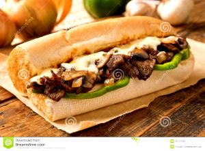 100 G Steak and Cheese Submarine Sandwich with Fried Peppers and Onions on Roll