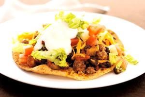 100 G Taco or Tostada with Beef, Cheese, Lettuce, Tomato and Salsa