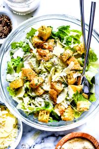 2 1/2 cups romaine, 2 tbsp dressing, 1 tsp cheese and 6 croutons Caesar Supreme Complete Salad Kit