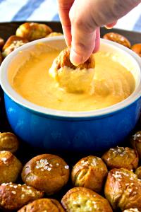 4 breadsticks and sauce Warm Pretzels with Craft Beer-Cheese Dipping Sauce